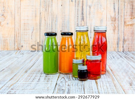 Juice bottle on wooden background