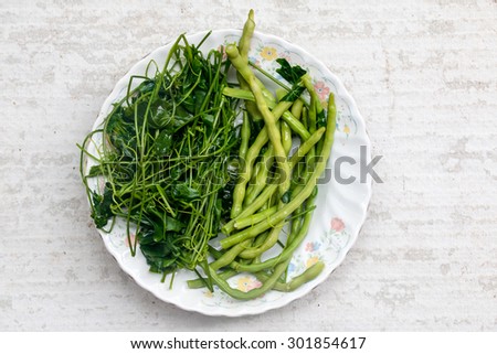 Boiled vegetables in dish on white background