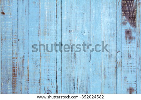 Old wooden painted light blue rustic background, paint peeling