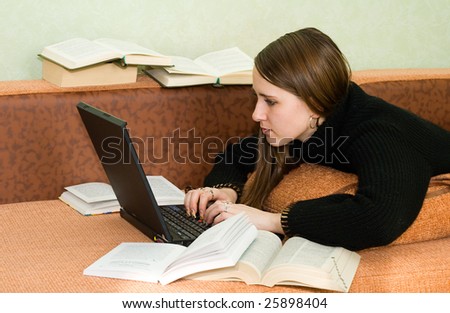 young pretty women on couch working with laptop computer