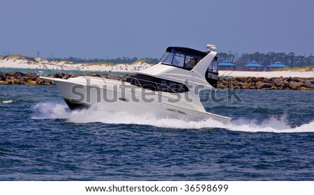Small yacht cruising in blue sea