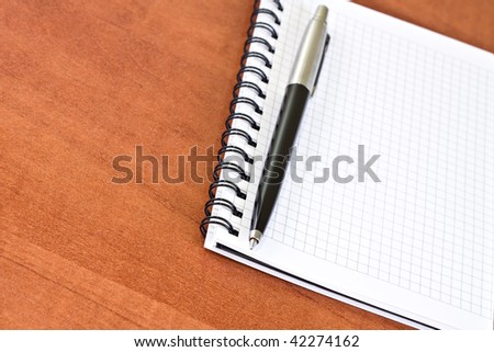 Notebook and pen on the desk