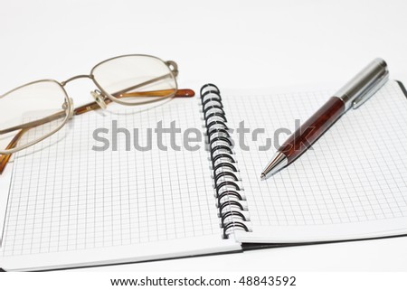 planner, pen and glasses on white background