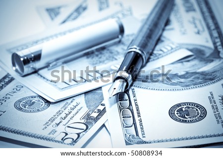close-up pen on us money. blue toning