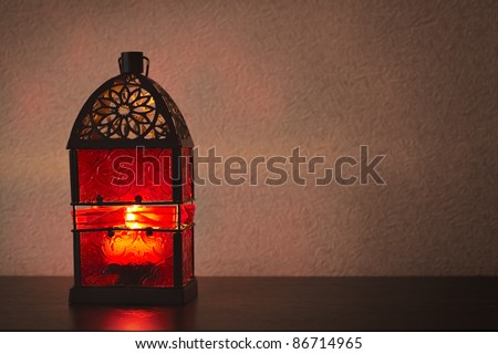 Old fashioned lantern in dark room