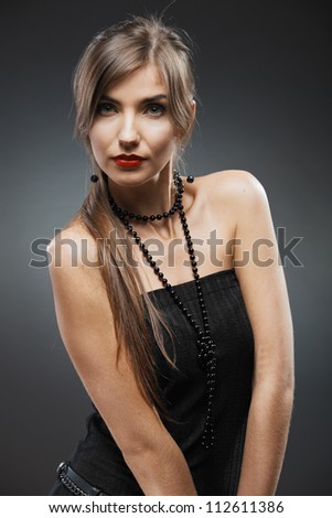 Woman fashion beauty close up portrait. Evening black dress.