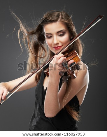 Woman long hair portrait isolated on gray background. Music play violin