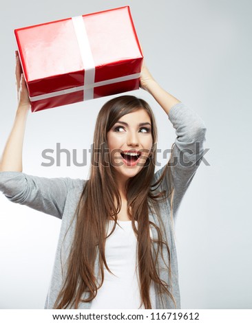 Christmas isolated woman portrait hold christmas gift. Smiling happy girl on white background.
