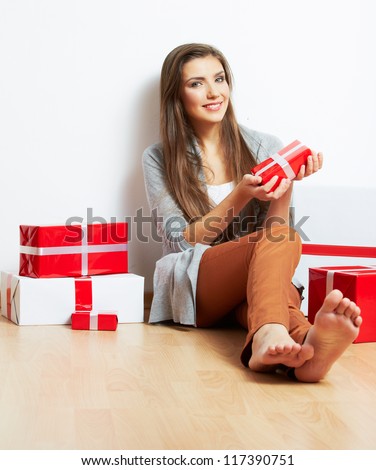 Smiling Woman portrait in christmas style with red, white box gift , isolated on white background.