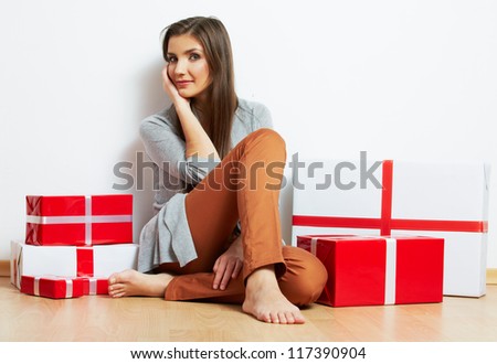 Smiling Woman portrait in christmas style with red, white box gift , isolated on white background.