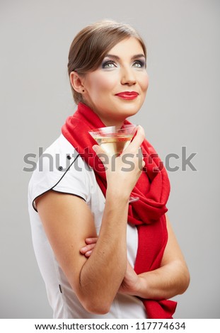 Young beautiful celebrate woman drink wine. Smiling female model holiday portrait against isolated studio background. Big toothy smile.