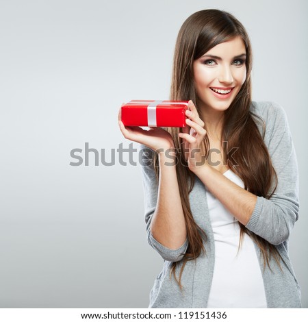 Young woman portrait hold gift in christmas color style Smiling happy girl on white background Young woman portrait hold gift in christmas color style Smiling happy girl on white background