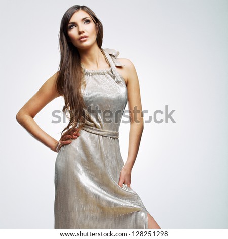 Looking up woman in evening dress . young model with long hair studio posing