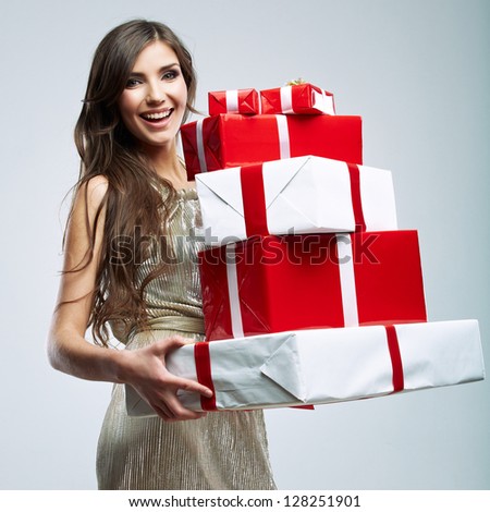 Gift box in the hands of young woman. Happy woman  isolated. Evening dress of gold color.
