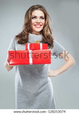Gift box in the hands of young woman. Happy woman isolated.