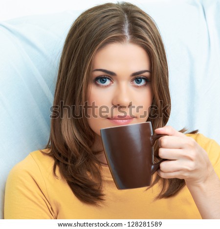 Woman drink tea with mug. Close up portrait.