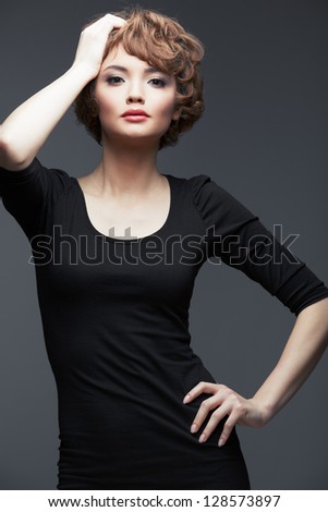 Young woman portrait standing against studio background. isolated fashion portrait .