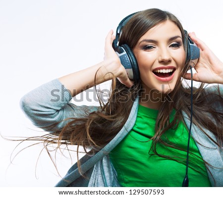 Young Woman With Headphones Listening Music .Music Teenager Girl Dancing Against Isolated White Background