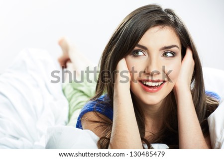 Beautiful smiling  woman portrait. Lying  bed . Close up face .