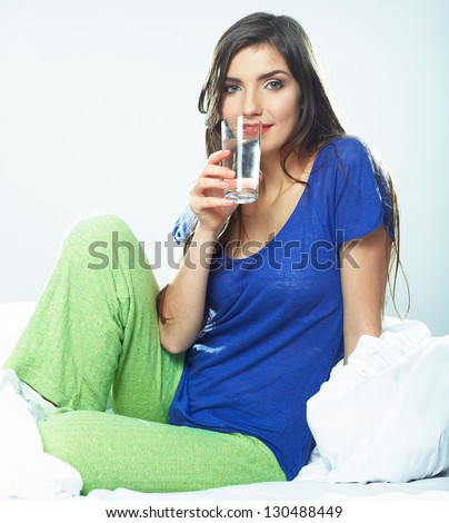 Woman drink water . Female smiling model .