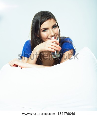 Woman hold water glass, seat in bed. Isolated portrait.