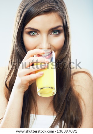 Young woman close up portrait drink juice. Female model happy smile.