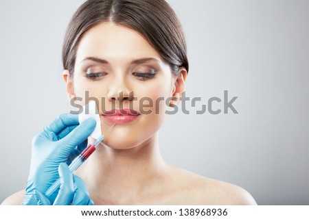 Smiling Beauty Woman face surgery close up portrait. Female model.