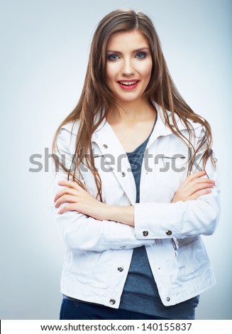 Casual style young woman posing on isolated studio background. Beautiful girl portrait. Female model poses.