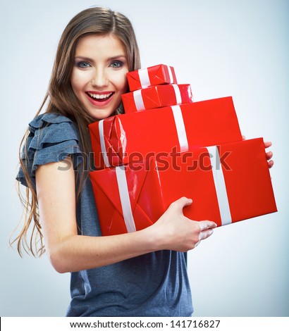 Portrait of casual young happy smiling woman hold red gift box Isolated studio background female model Portrait of casual young happy smiling woman hold red gift box Isolated studio background female model