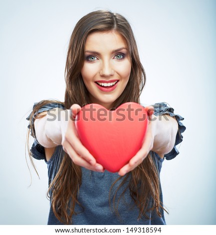 Heart. Love symbol. Portrait of beautiful woman hold Valentine day symbol. Isolated studio background female model. Beautiful girl.