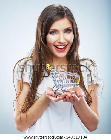 Casual style young woman posing on isolated studio background, hold water glass. Beautiful girl portrait. Female model poses.