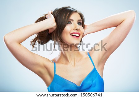 Beauty fashion style isolated portrait of happy young smiling woman. Evening blue dress. Isolated studio background female model.