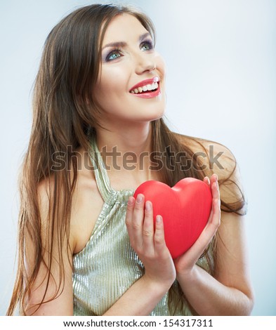 Red heart. Love symbol. Portrait of beautiful woman hold Valentine day symbol. Isolated studio background female model.