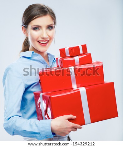 Business woman hold gift box in christmas color style, studio portrait. Young female model.