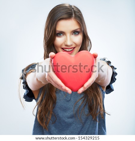 Heart. Love symbol. Portrait of beautiful woman hold Valentine day symbol.. Beautiful girl.