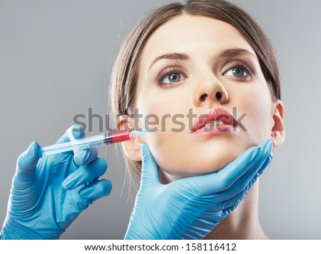 Beauty Woman face surgery close up portrait. Female model.