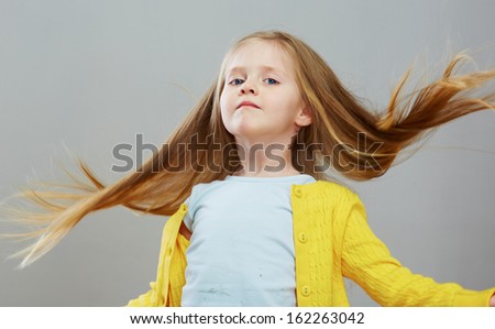 Portrait of fashion girl with long blond hair. Isolated portrait.