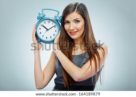 Portrait of business woman holding watch. Business time concept.