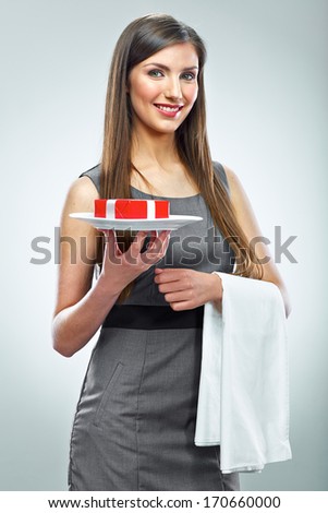Smiling business woman hold red gift on a plate. Conceptual business portrait.