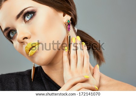 Yellow nails and lips. Beauty woman portrait