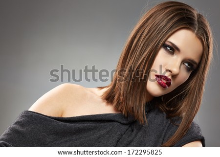 Close up beautiful woman face portrait. Sensual young model with straight hair.