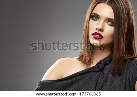 Beautiful model portrait. Straight hair. Black dress.