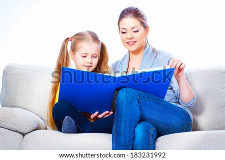 Little girl read book with mother.