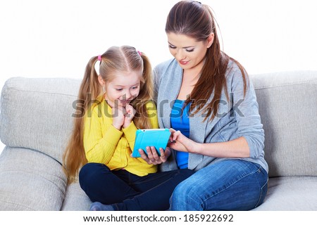 Child home education with tablet PC. White background isolated.