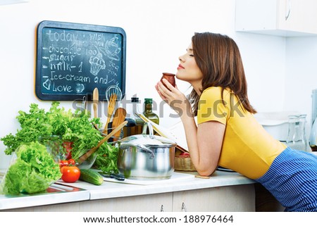 Woman sniff preparing food. Cooking woman.