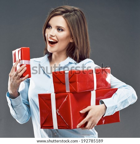Happy woman hold gift box. Studio portrait of young business woman.