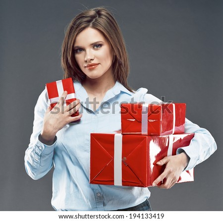 Office worker woman hold red gift. Smiling young business woman.