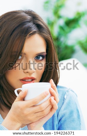 Woman coffee drink portrait. Young model.