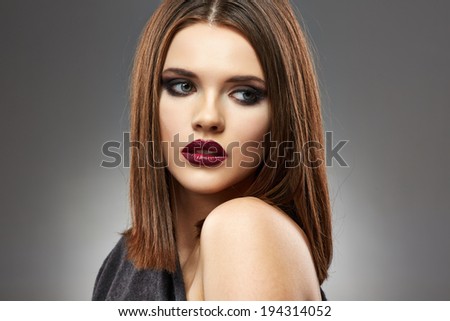 Close up beautiful woman face portrait. Sensual young model with straight hair.
