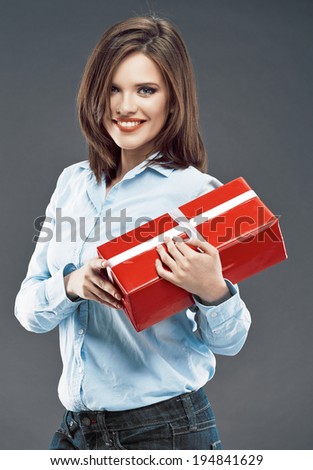 Office worker woman hold red gift. Smiling young business woman.
